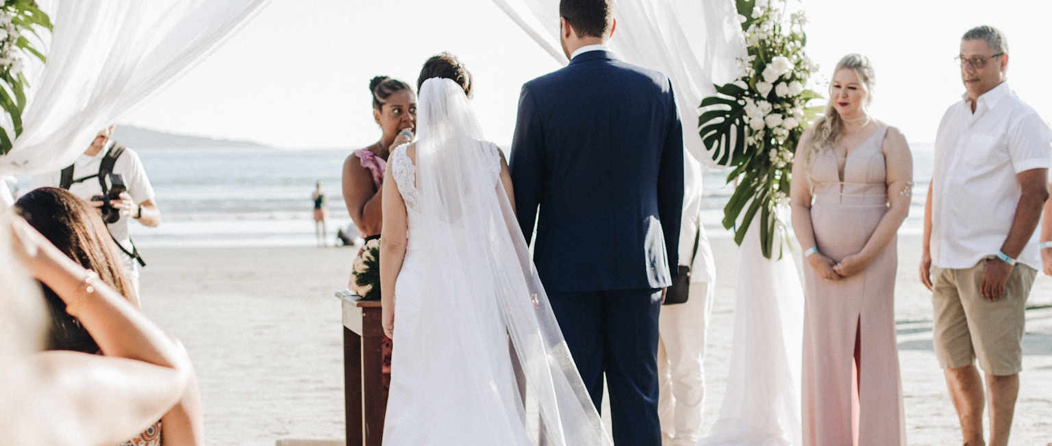 Legal vs symbolic destination wedding ceremony on the beach